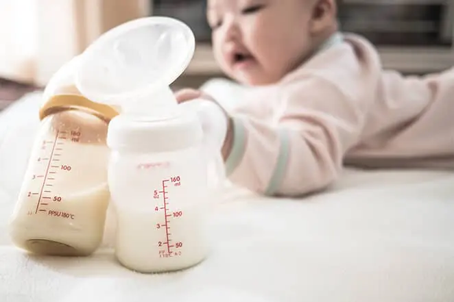 https://nestcollaborative.com/wp-content/uploads/2021/08/Nest-Collaborative-how-much-milk-does-my-baby-need.jpg.webp